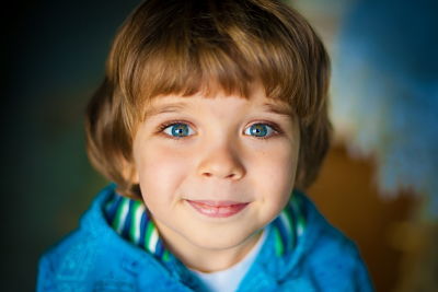 smiling green-eyed young boy